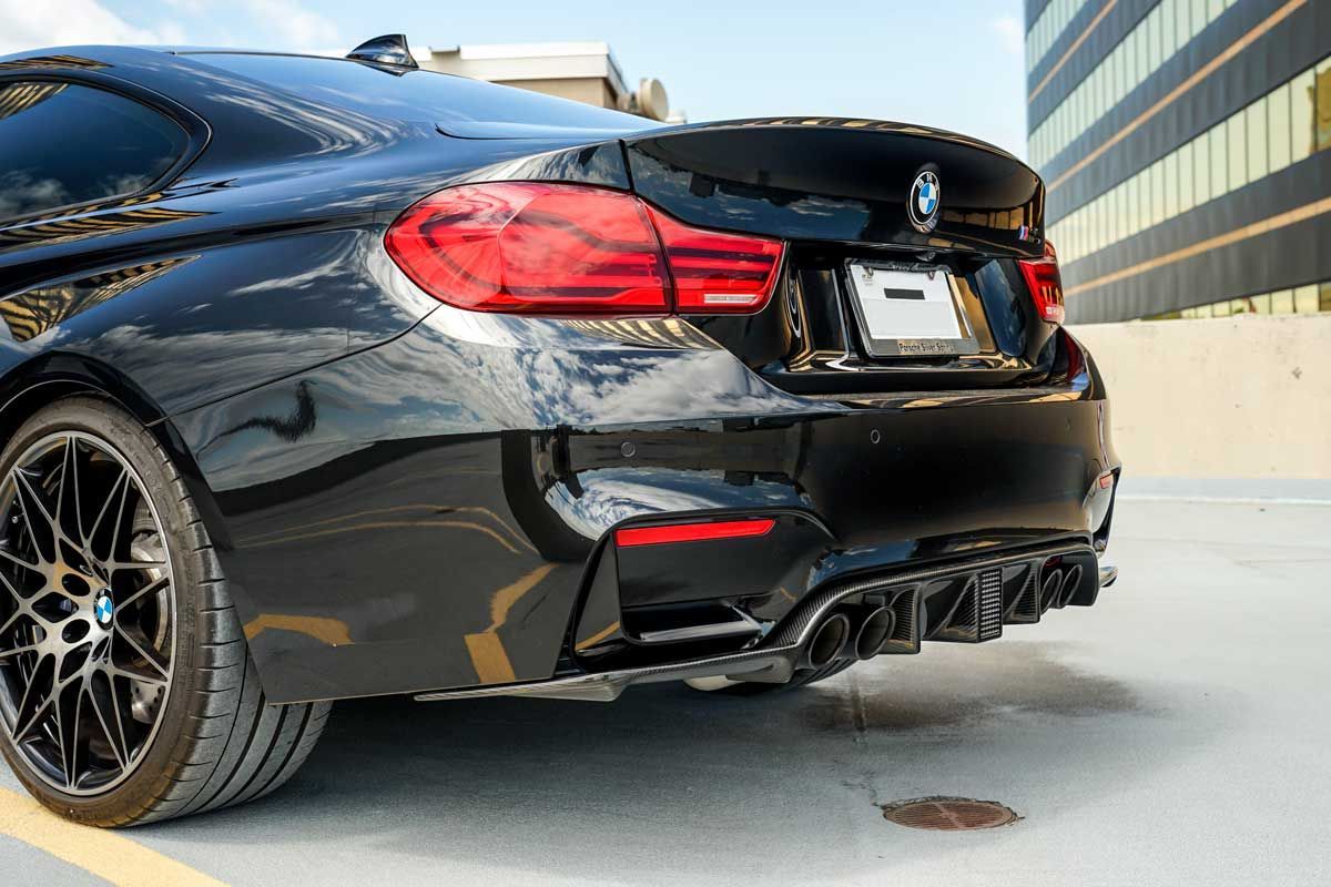 black bmw m4 with carbon fiber rear diffuser