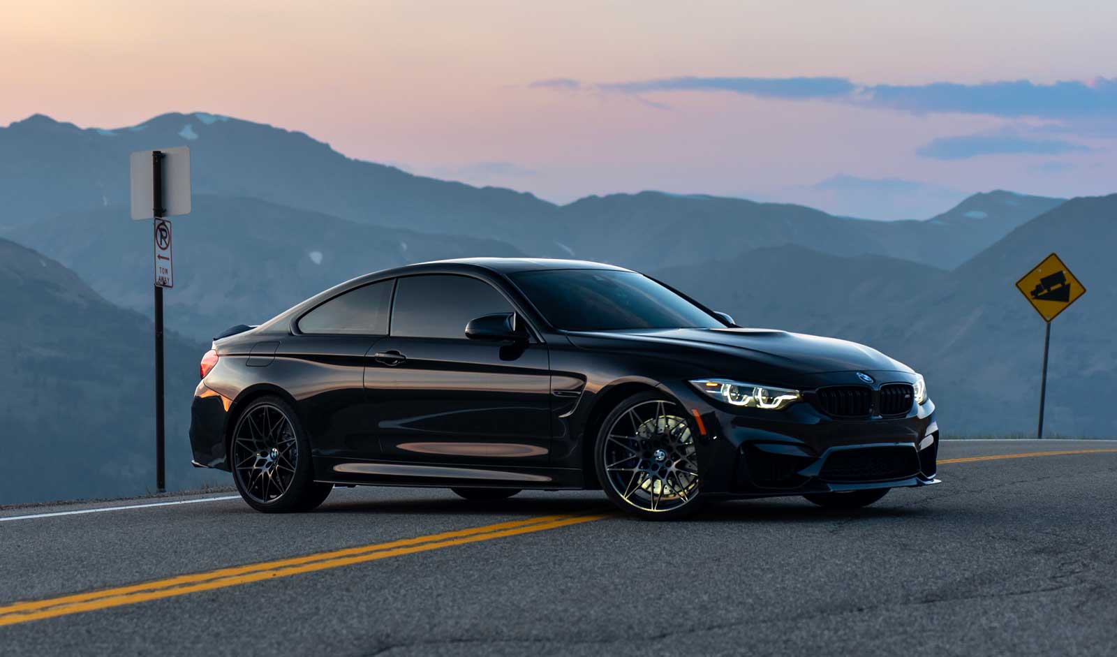 bmw f82 m4 parked in the middle of the road