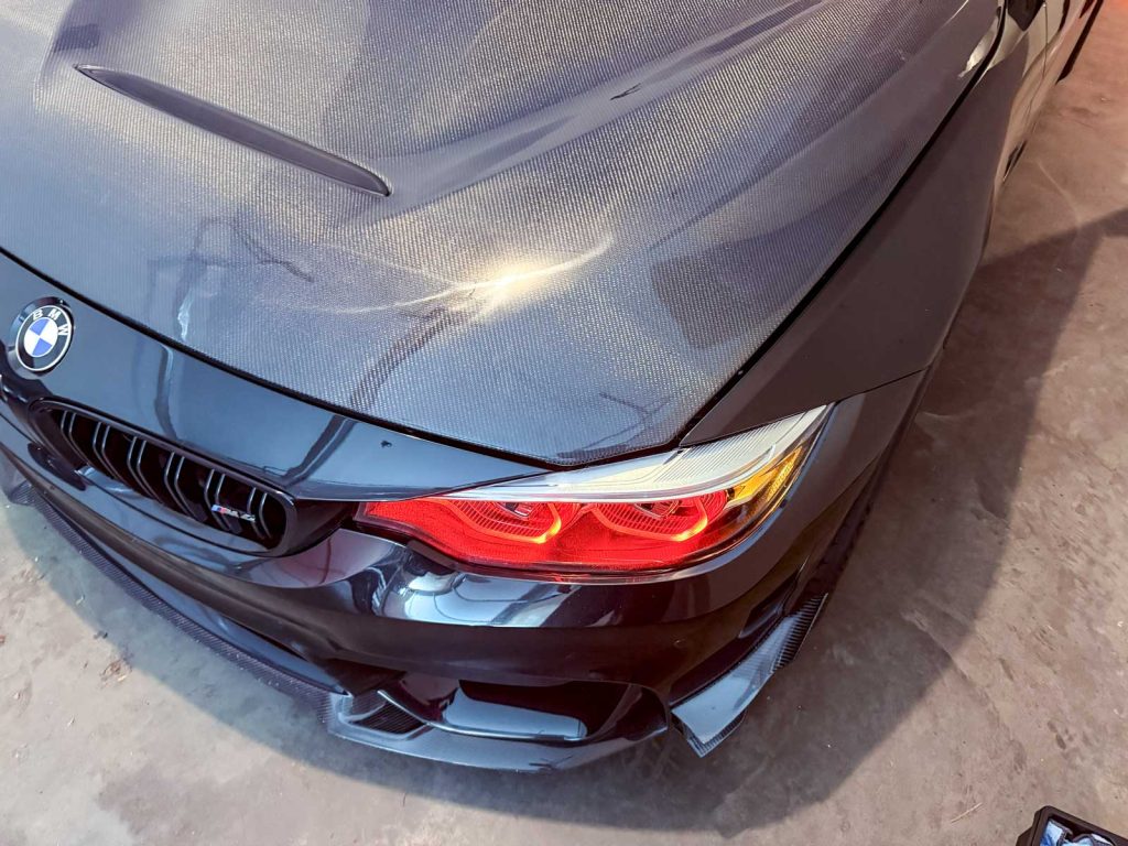 bmw carbon fiber hood showing large gaps between other body panels